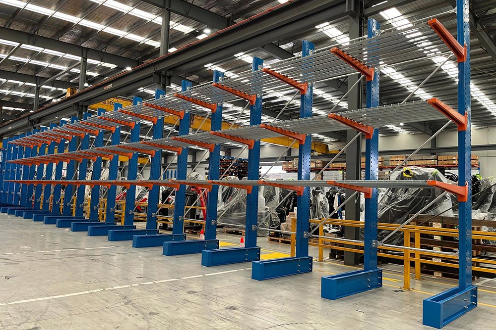 Single-sided cantilever rack against warehouse wall
