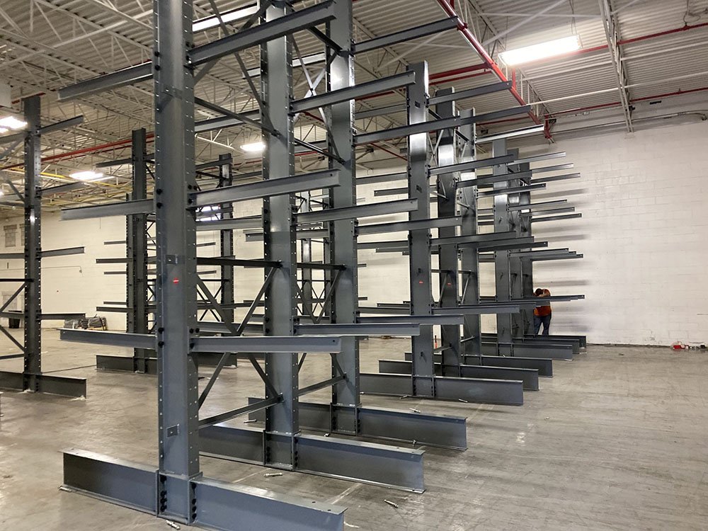 Double-sided cantilever rack storing steel bars and PVC pipe