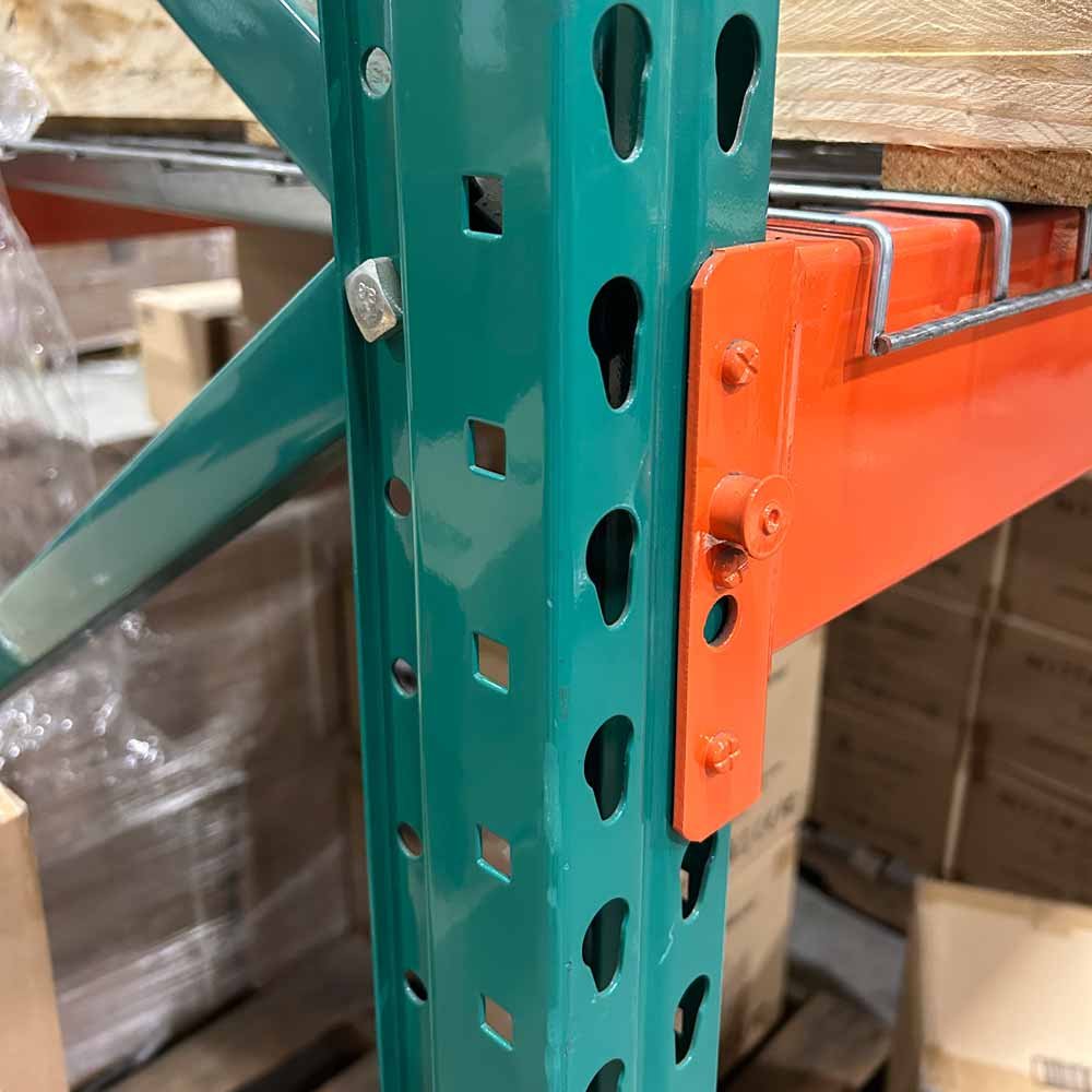 Teardrop perforation upright with hook-in beam connector and locking safety pin