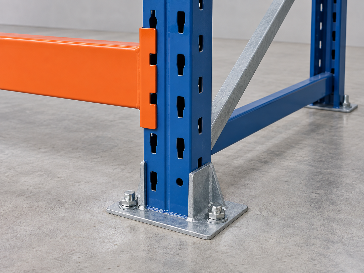 Pallet rack base plate fixed to concrete with anchor bolts