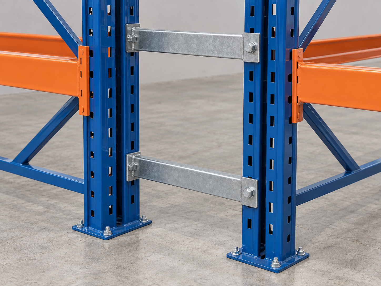 Steel row spacers connecting back-to-back pallet rack frames