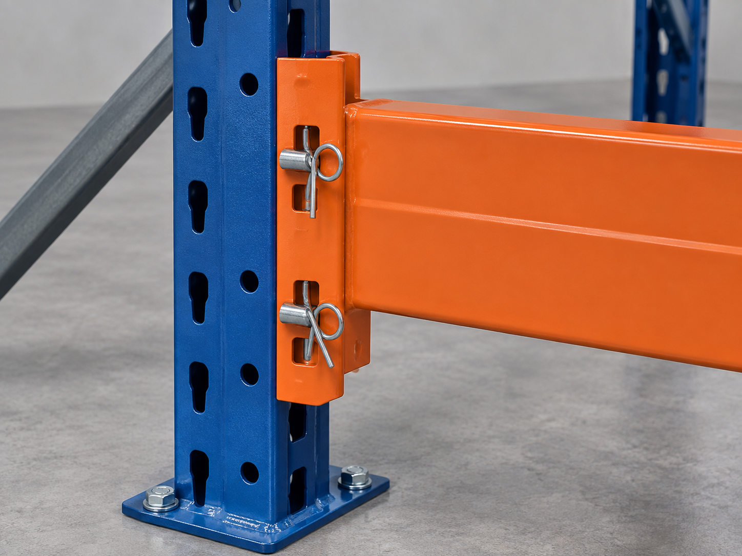 Safety pins and beam clips securing a pallet rack load beam